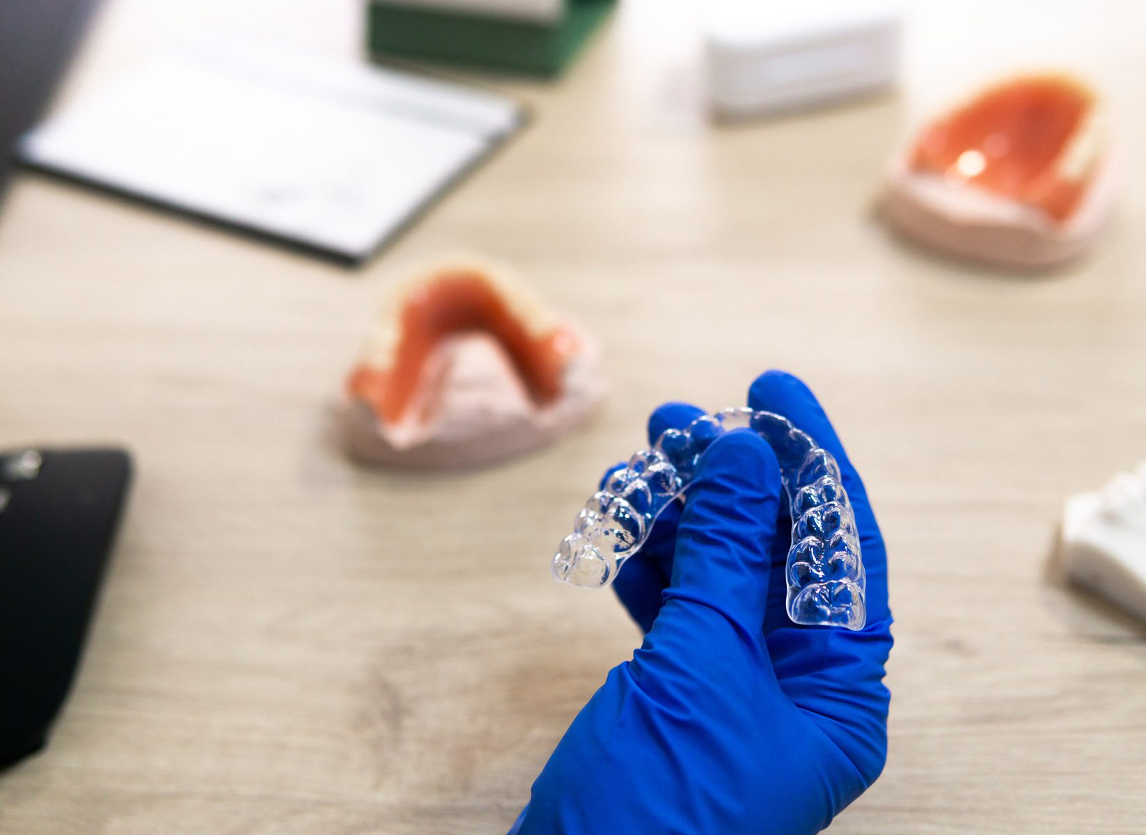 A movement splint in the hands of a dental technician - Orthodontic concept